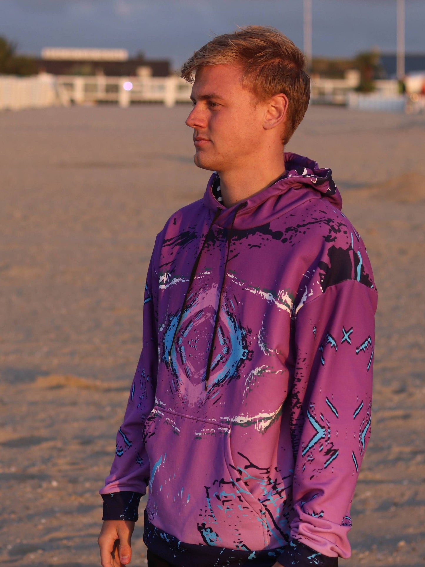 A purple mens pullover hoodie with an abstract retro print. great looking casual wear with a retro 80s style look