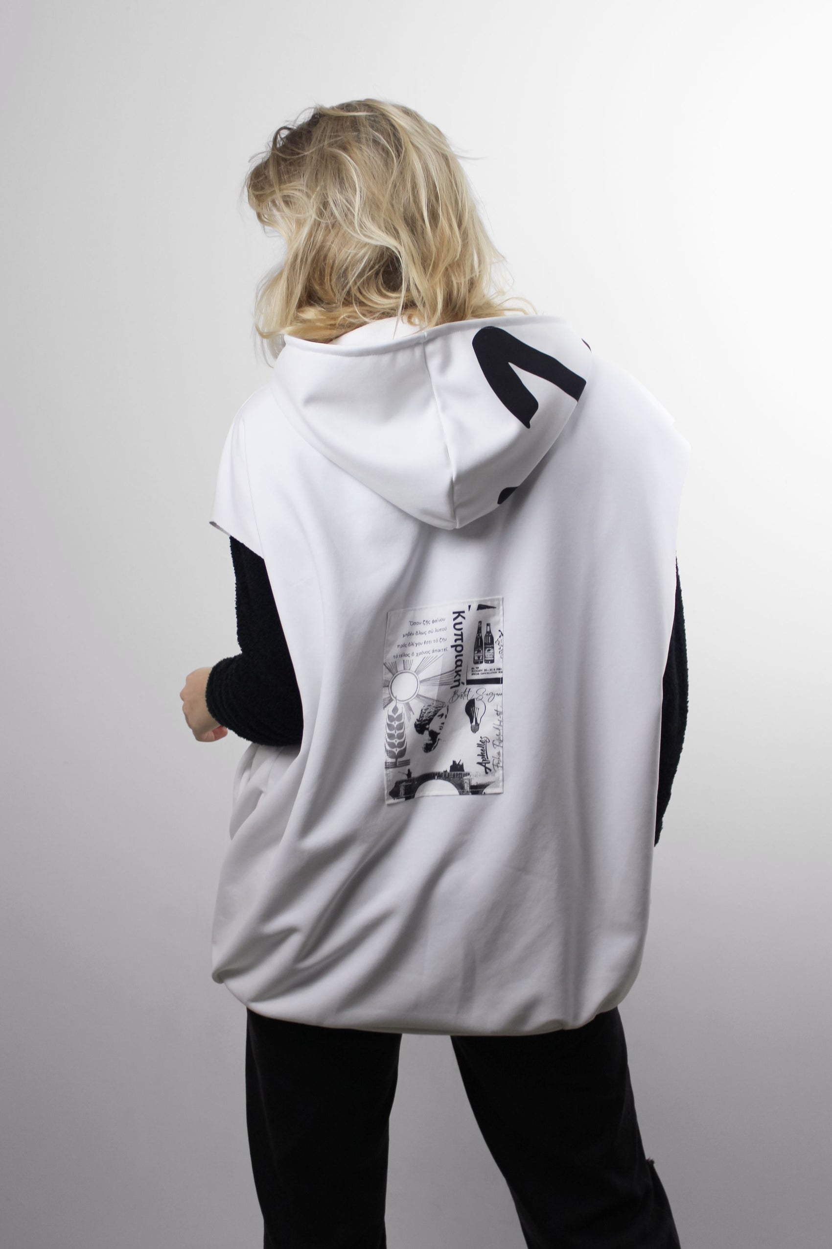 Stand out with our Sleeveless Hoodie featuring a giant production number on the hood. Each hoodie is a unique, numbered masterpiece. Locally sewn in the Netherlands for a touch of exclusivity.