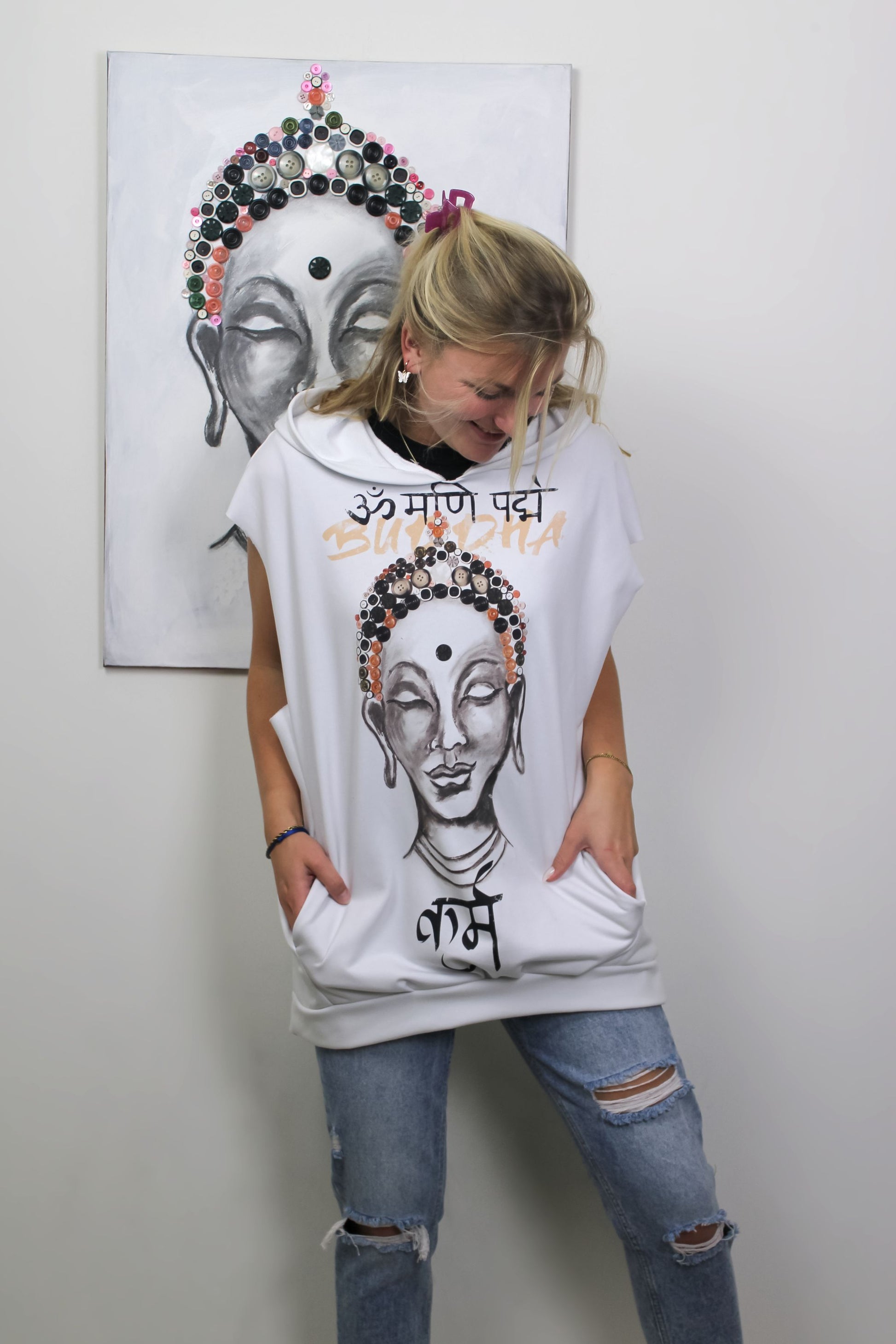 Buddha Hoodie displayed against the original artwork by Kim Vermeulen, creating a captivating juxtaposition of fashion and art.