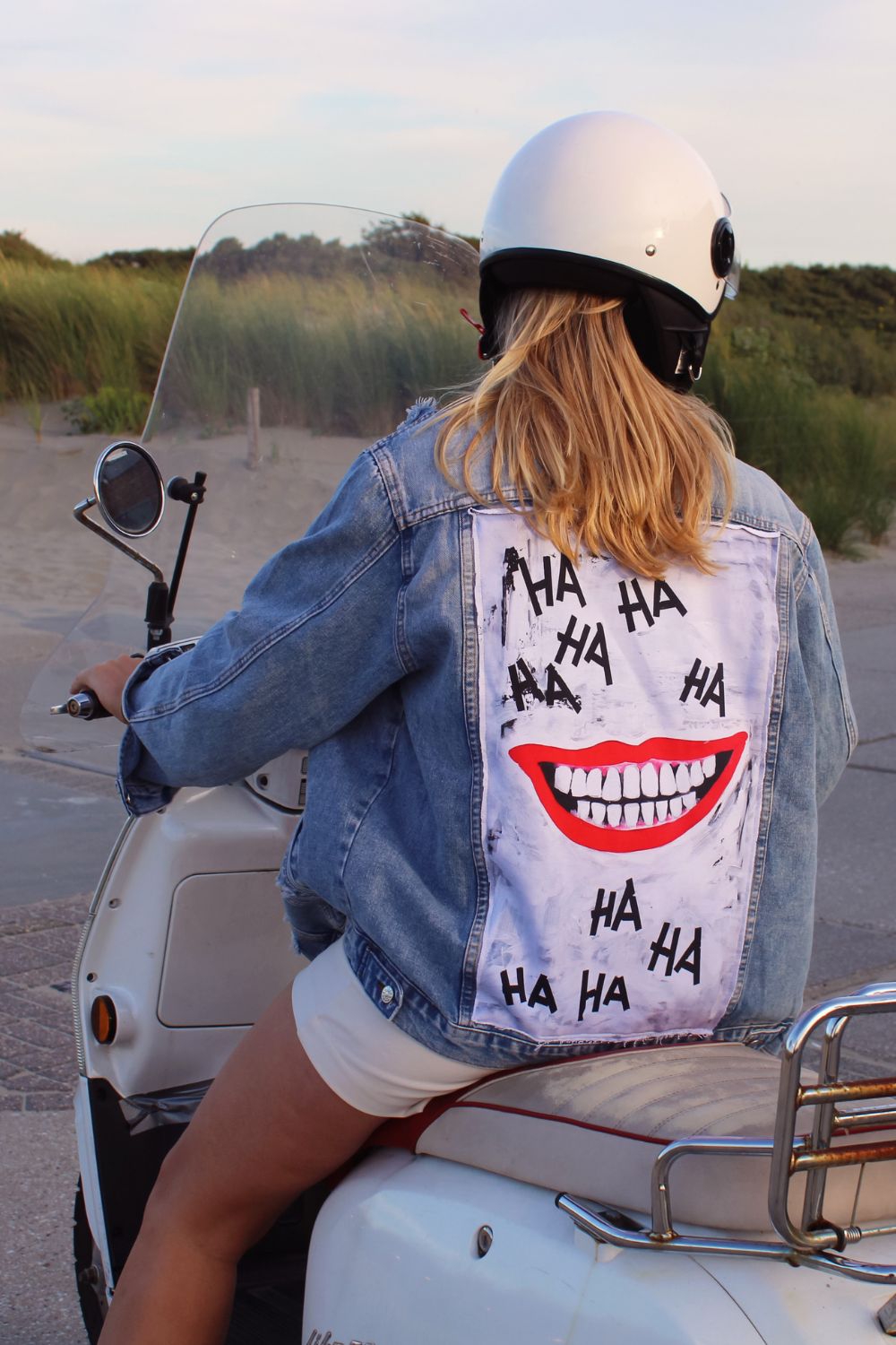 The joker style denim jacket with laughing mouth design