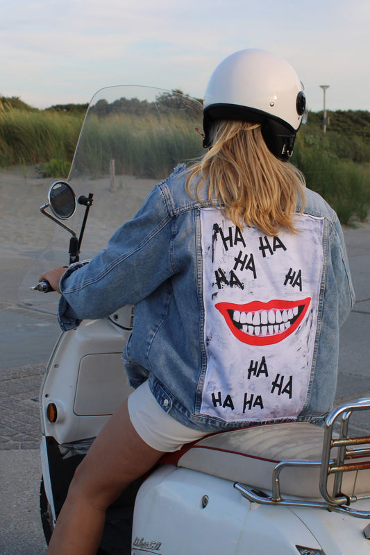 The joker style denim jacket with laughing mouth design