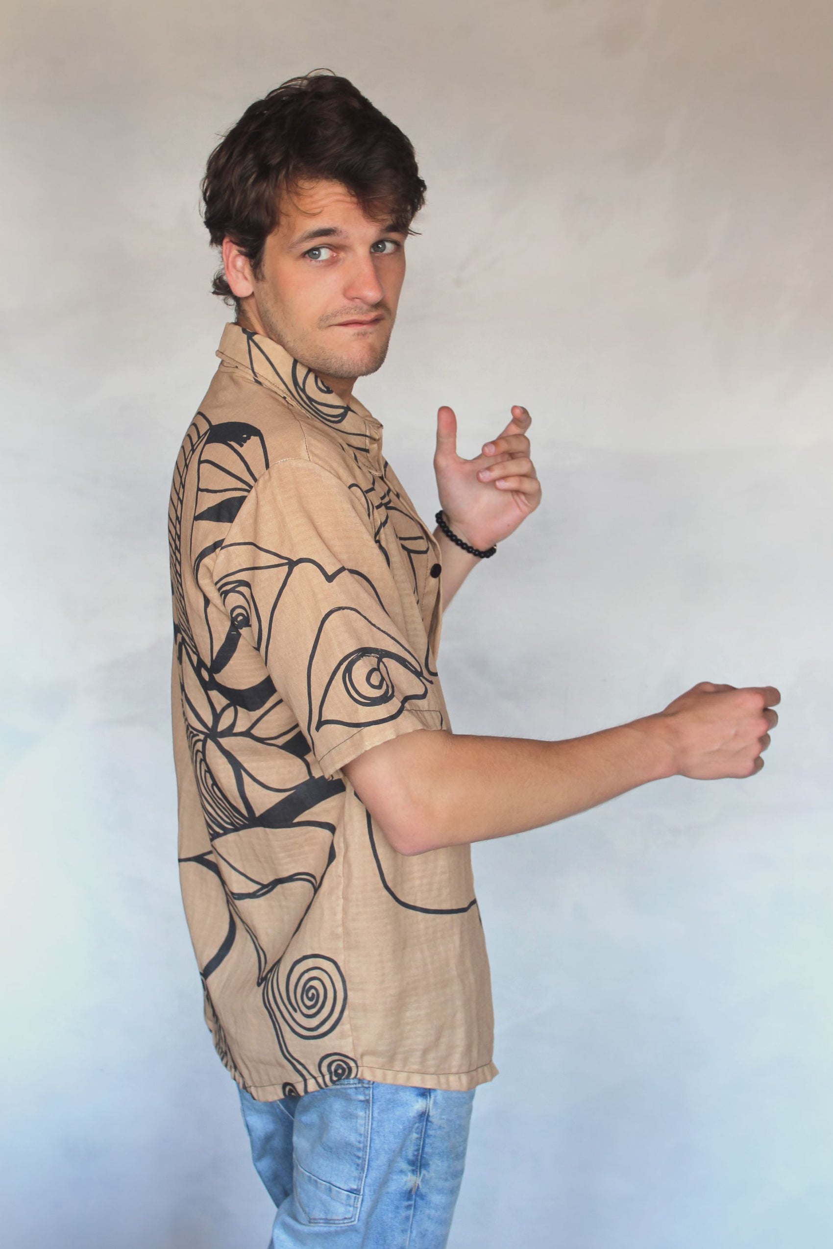 Unique mens summertime buttonup shirt with light brown color palette