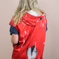 back view of sleeveless red hoodie with raw finish at armholes
