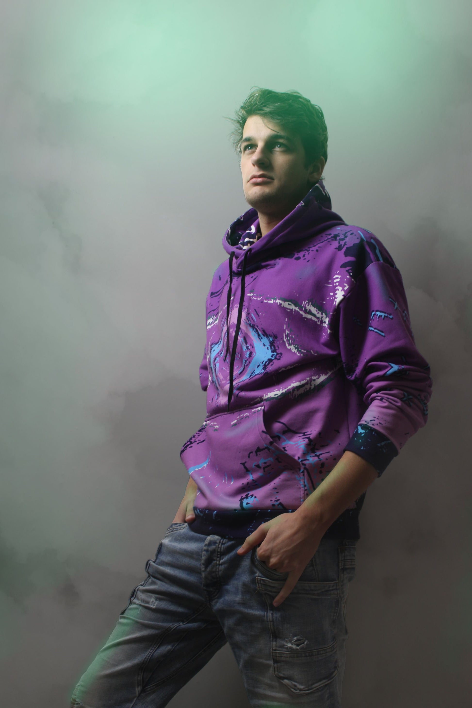 a purple hoodie with an old school 80s retro arcade style