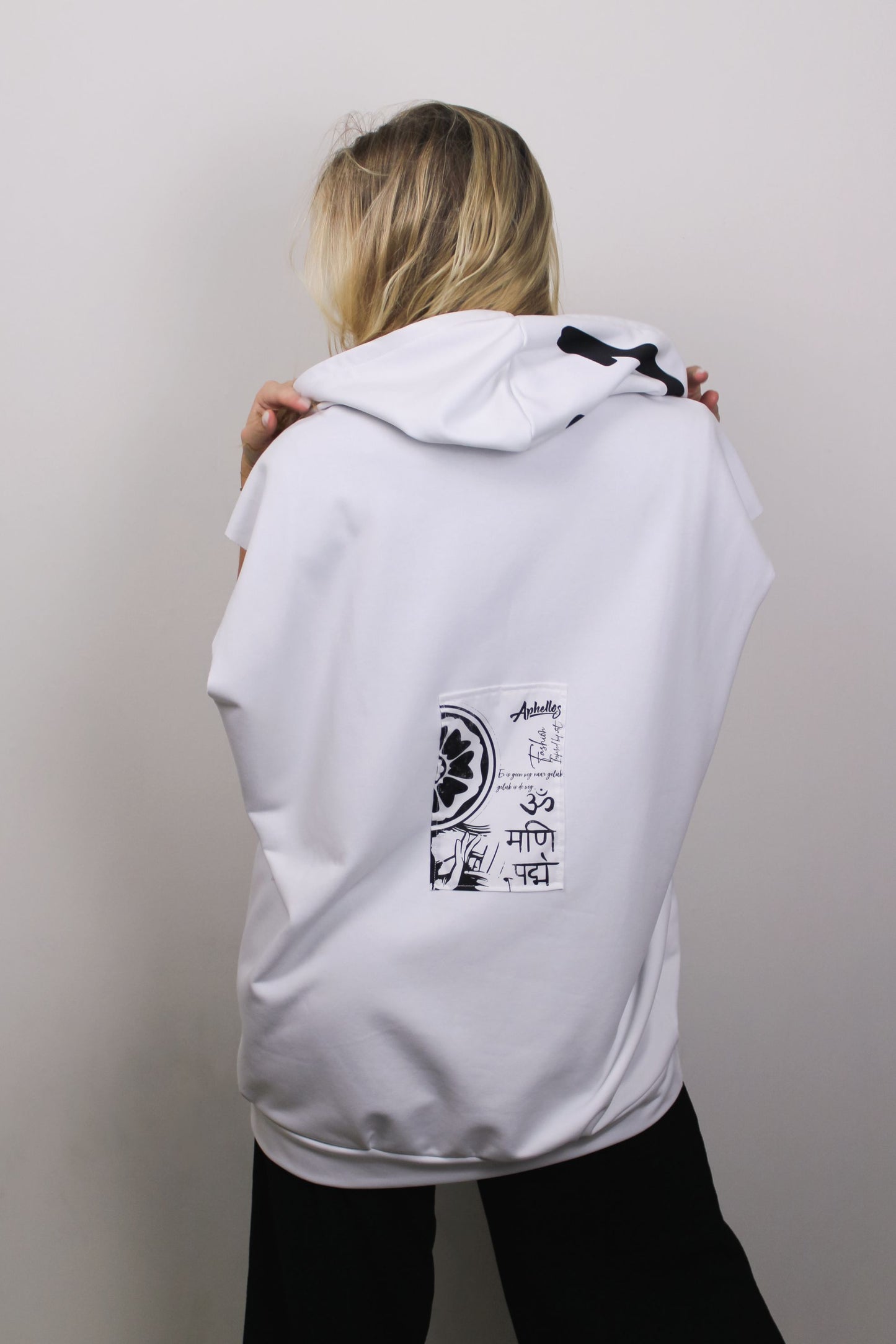 Detailed view of back panel featuring intricate Buddhist imagery on the Hoodie.
