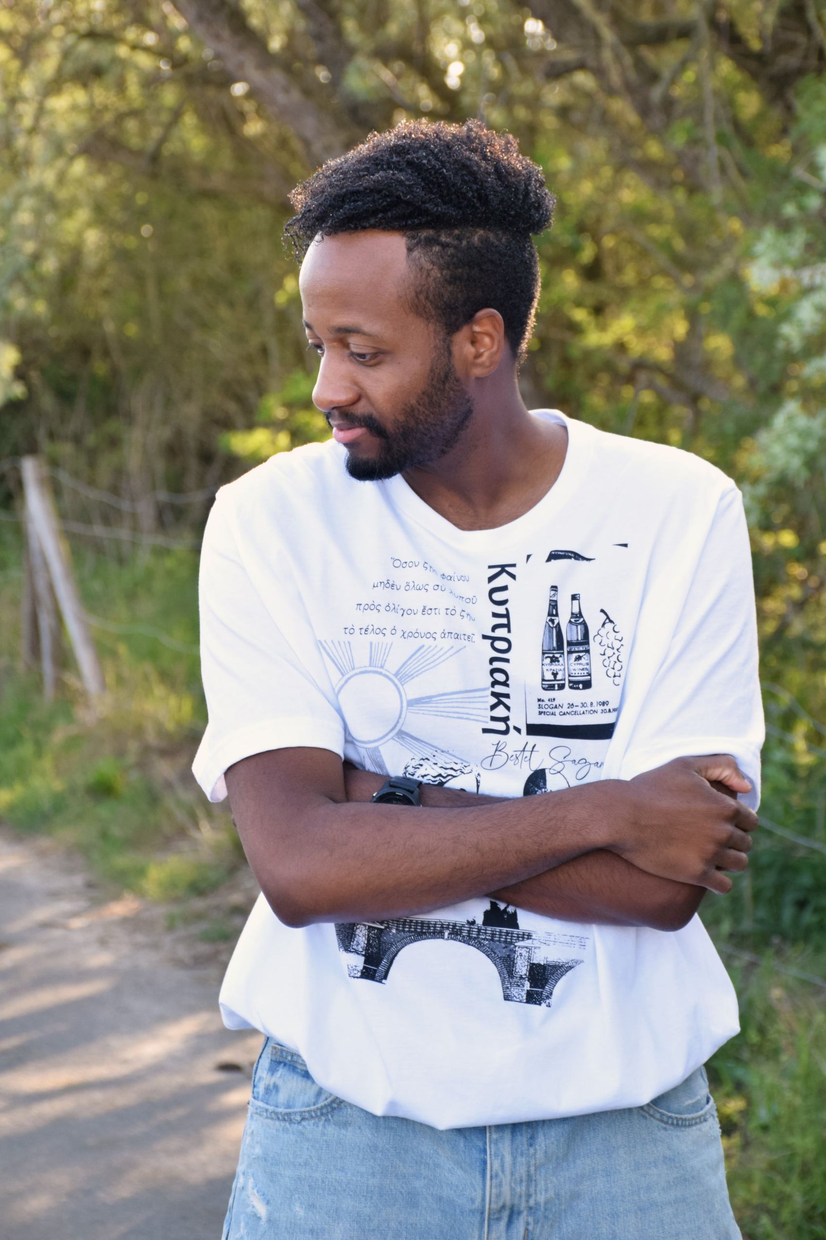 White shirt with black Hellenic art, blending classical Greek design and modern fashion.