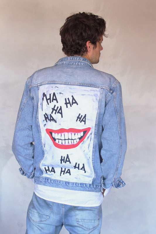 a sky blue denim jacket with smile on the back panel