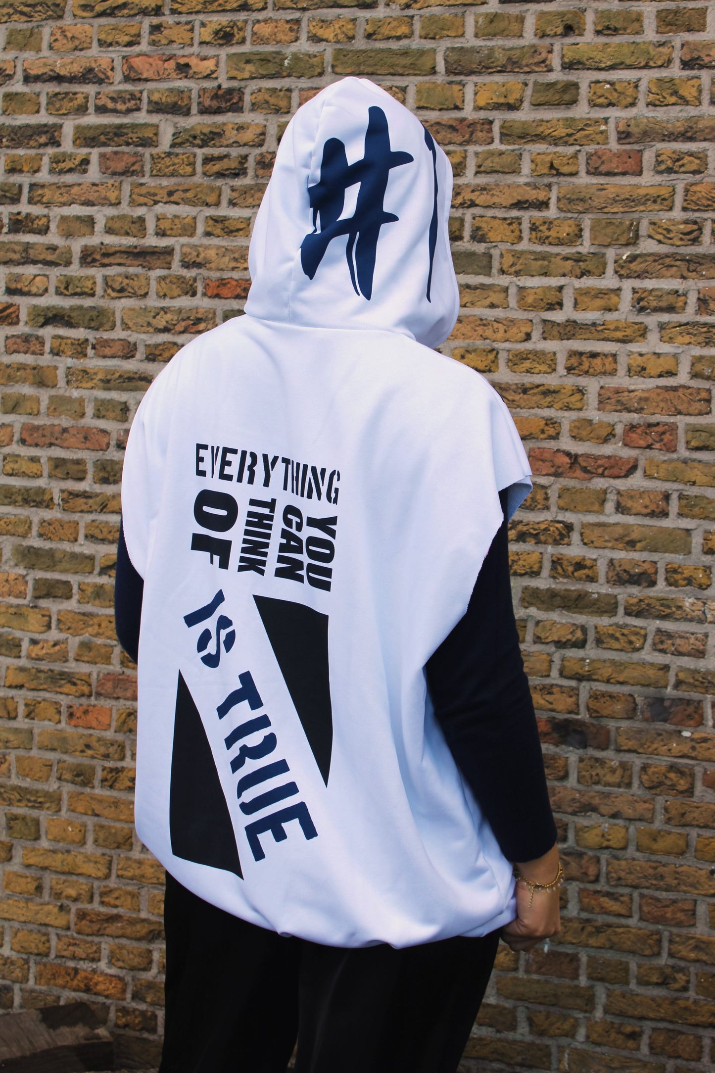 Oversized-fit hoodie crafted in the Netherlands, showcasing an artistic female face graphic and text details for a one-of-a-kind look.