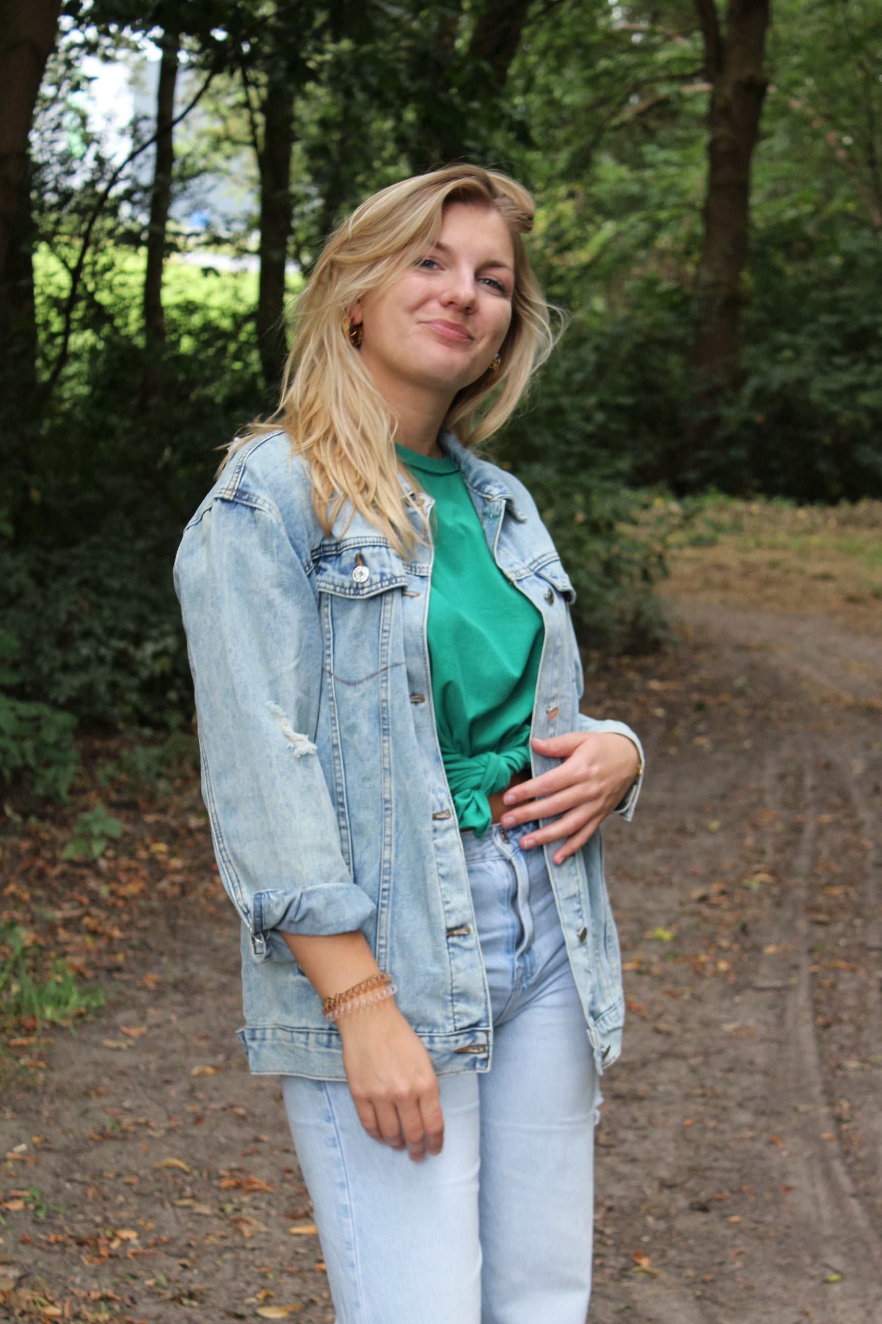 Loose fit light blue denim jacket with a unique Olive Oyl design, perfect for layering and casual outfits.