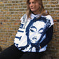 Oversized hoodie featuring a large, sketched female face in dark blue lines, with bold text enhancing the unique design.