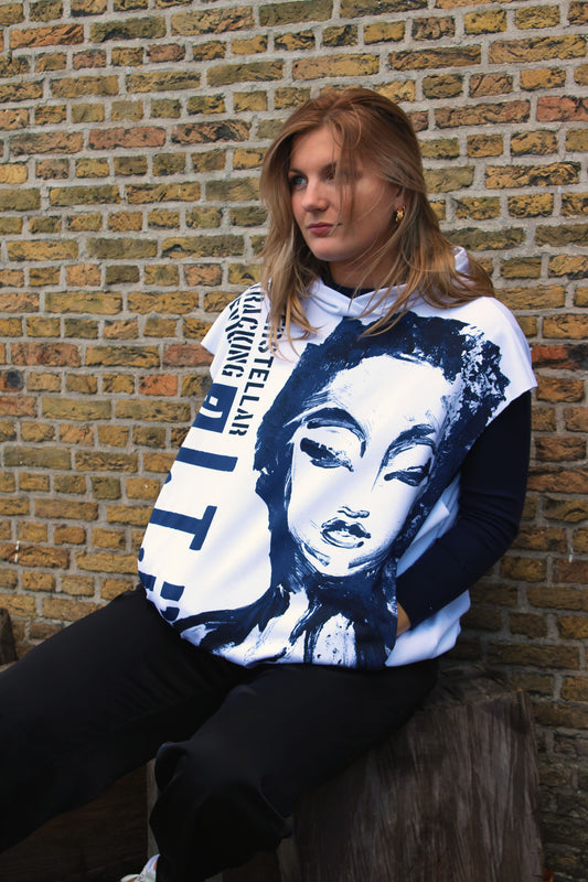 Oversized hoodie featuring a large, sketched female face in dark blue lines, with bold text enhancing the unique design.