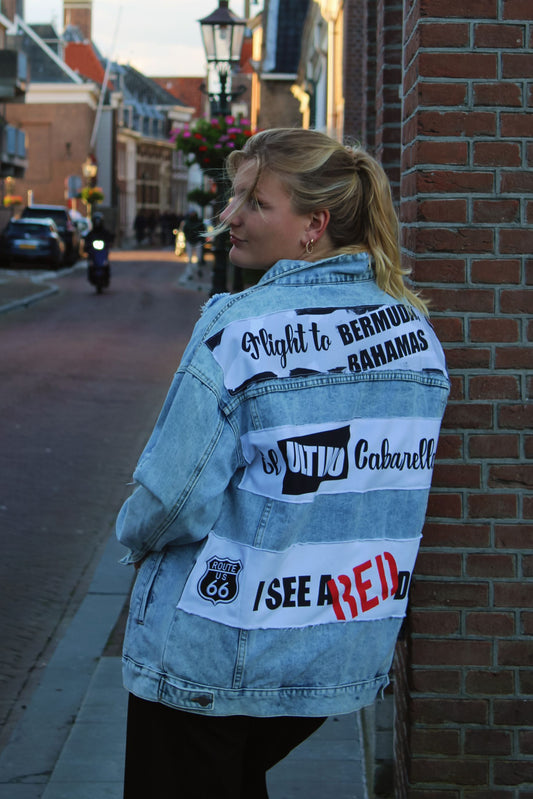 Custom oversized light blue denim jacket featuring unique back panels with artistic musical influences