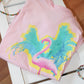 Pink Flamingo T-Shirt: A vibrant pink T-shirt with a tropical flamingo print on the front, perfect for embracing summer vibes