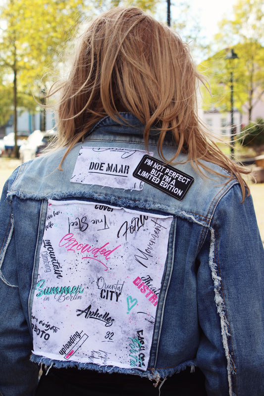 Statement jacket with unique black and white text panels featuring phrases like "uploading..." and "infra-red."