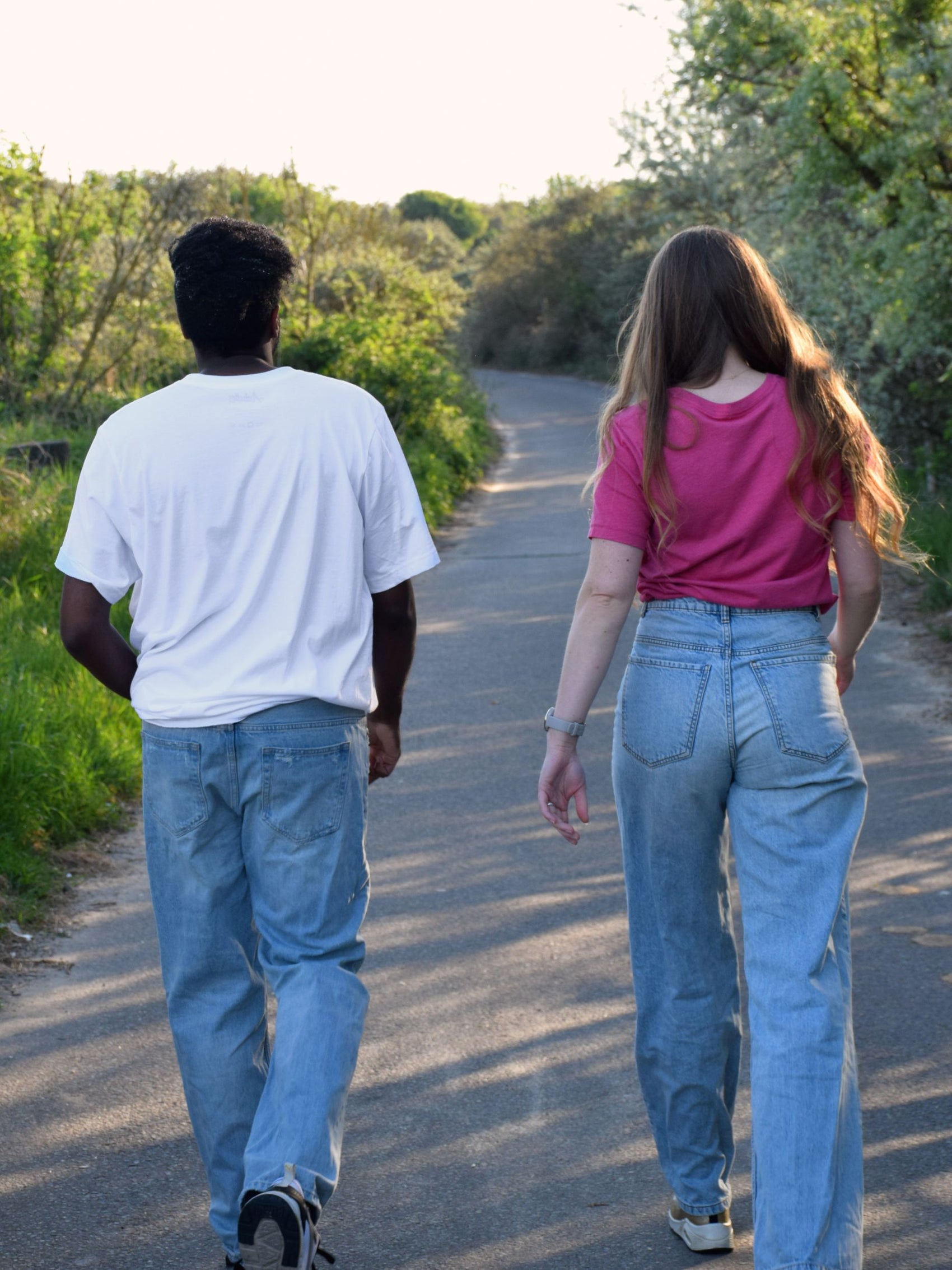 White T-shirt with Greek typography and artistic print inspired by ancient lettering.