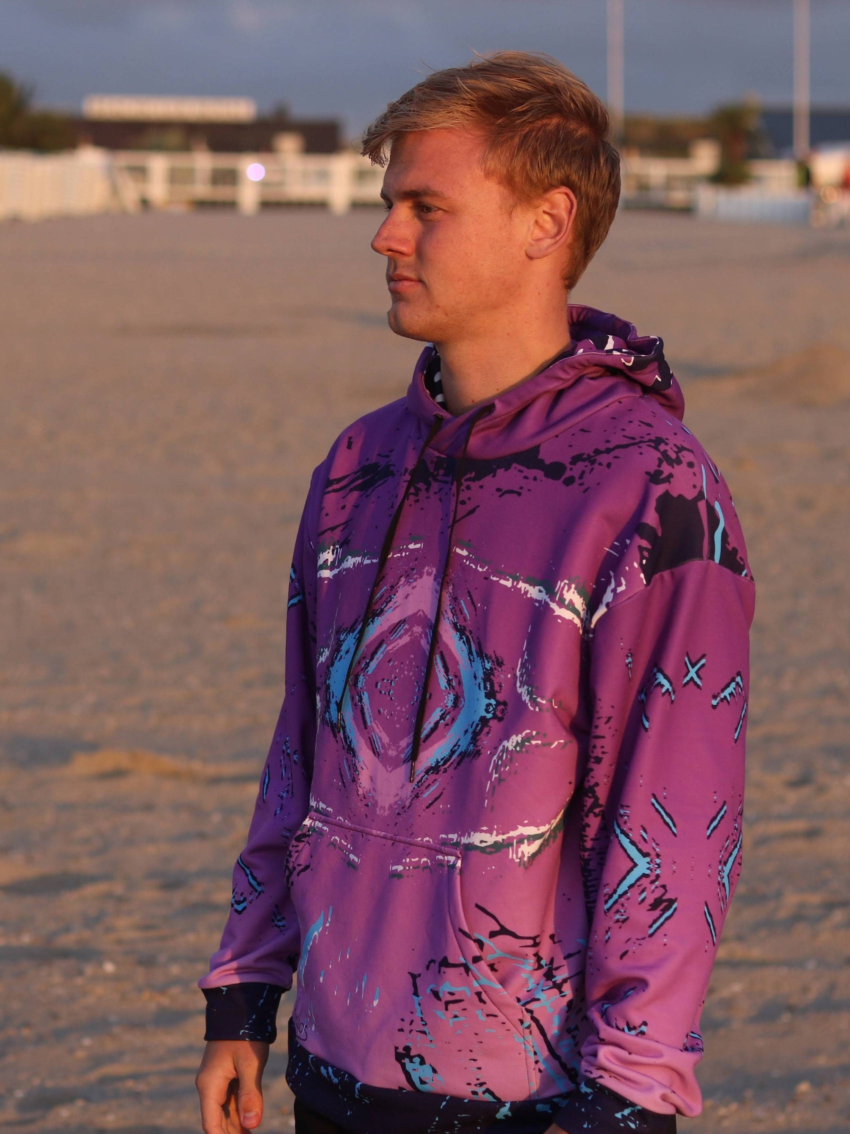 A purple mens pullover hoodie with an abstract retro print. great looking casual wear with a retro 80s style look