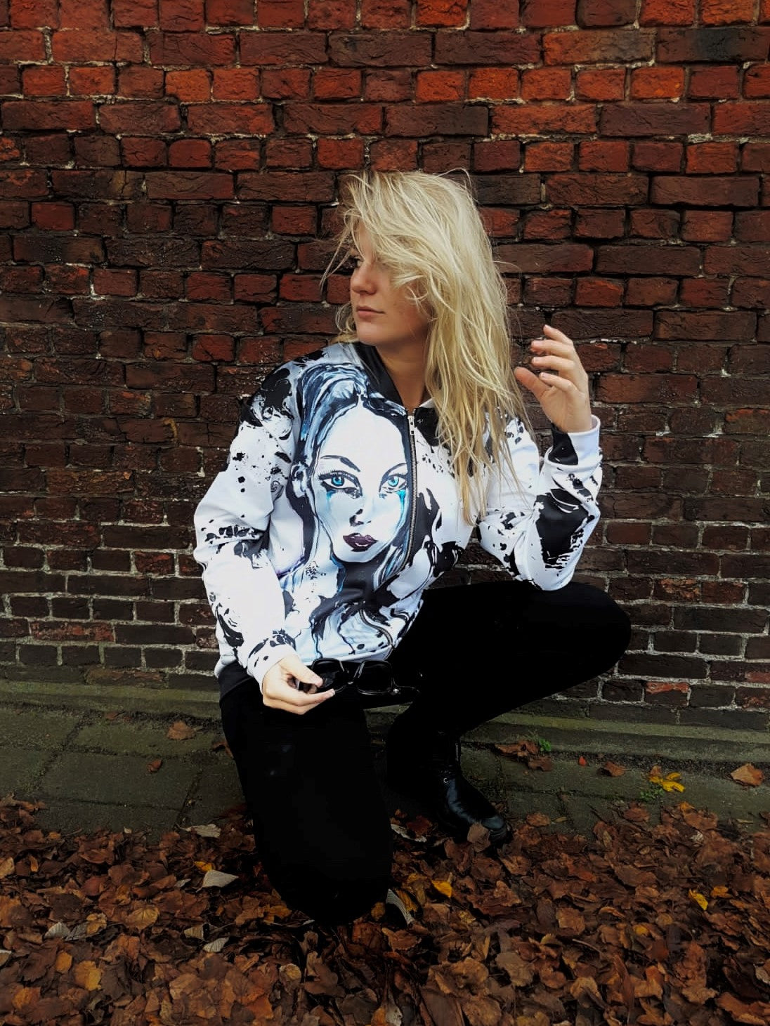 Jacket with an art based portrait of a beautiful lady on the front with zipper and long sleeves and made of polyester