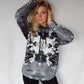 black and white lion hooded sweatshirt with an image that looks like a Rorschach inkblot test on the front
