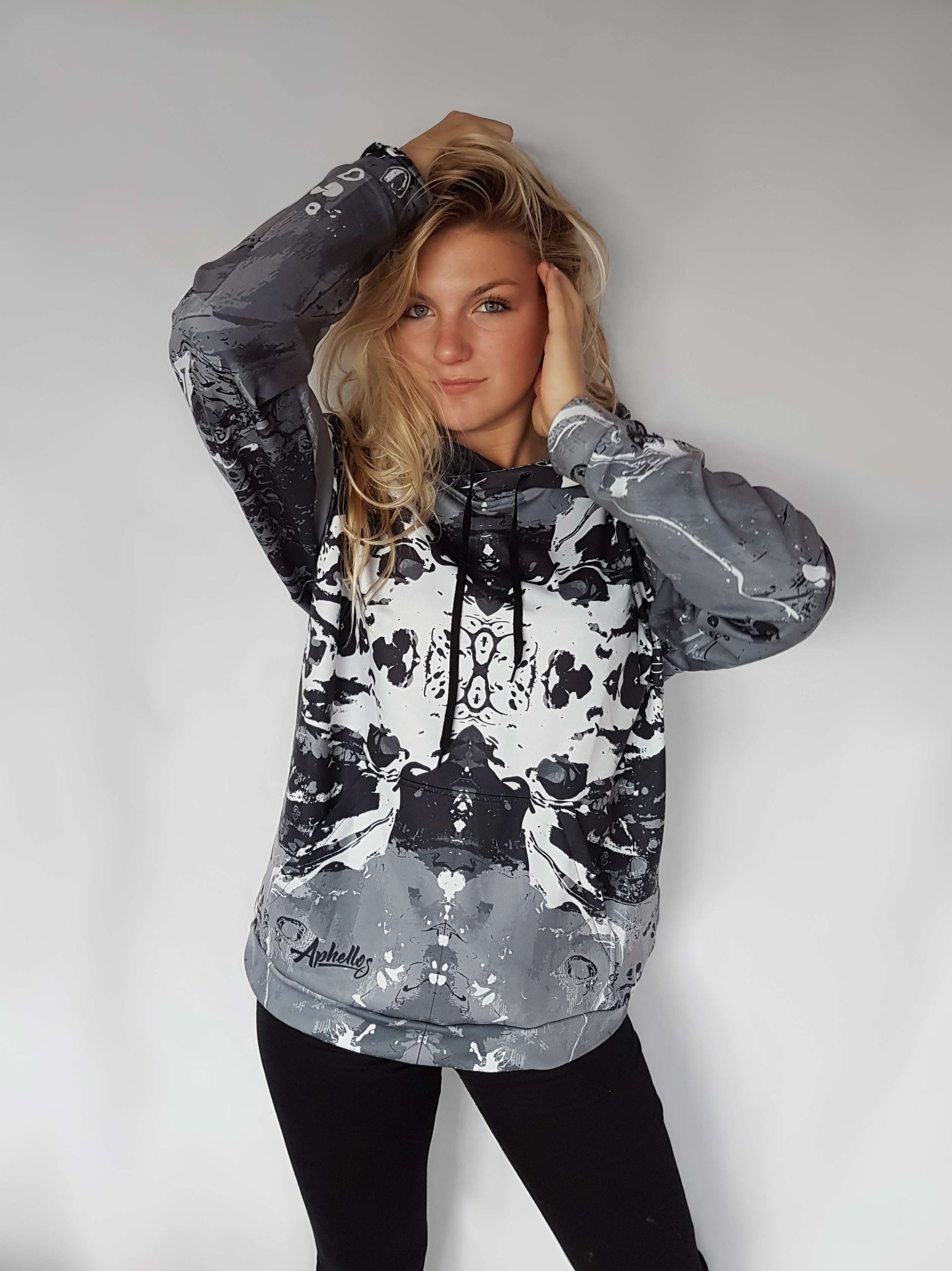 black and white lion hooded sweatshirt with an image that looks like a Rorschach inkblot test on the front
