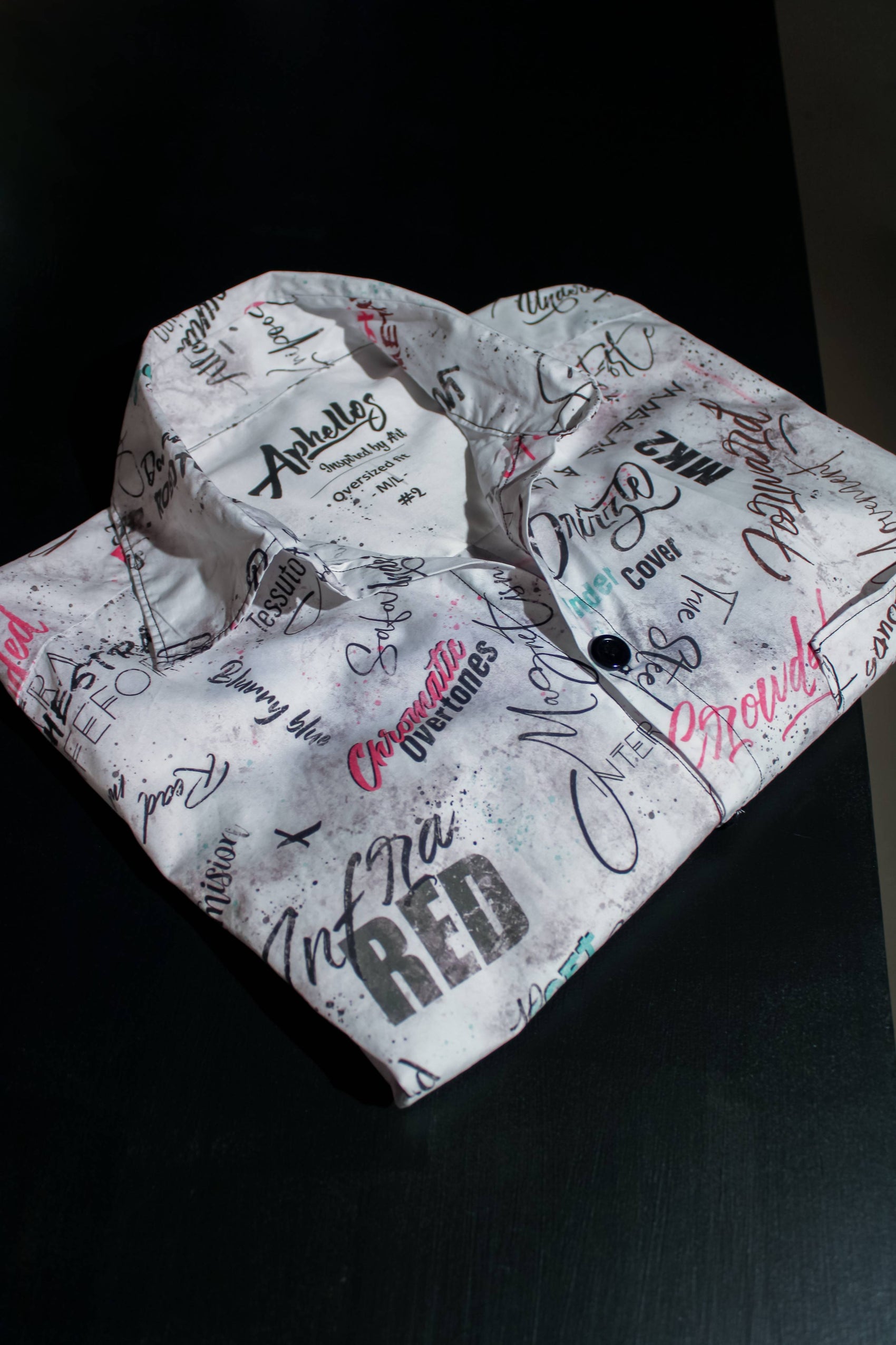 Discover the unique and handmade design of our Oriental City Blouse, featuring hidden references and decorative text.