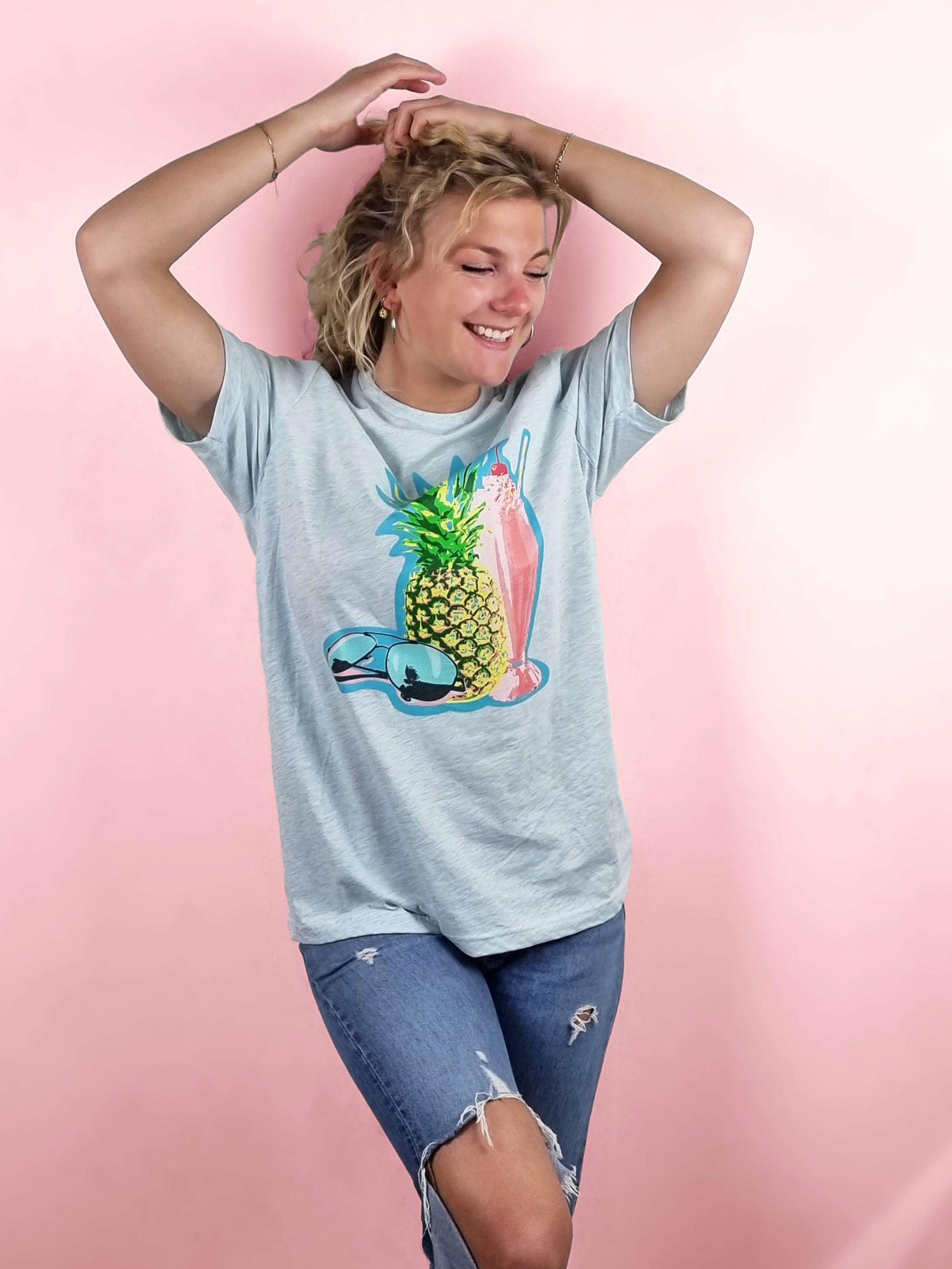 a beautiful blue t-shirt with a summer beach-like pineapple print