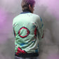 the backside of the light green retro jacket. the deep pink and purple contrasts very well with the lime green to create a very unique and colourful piece of outerwear