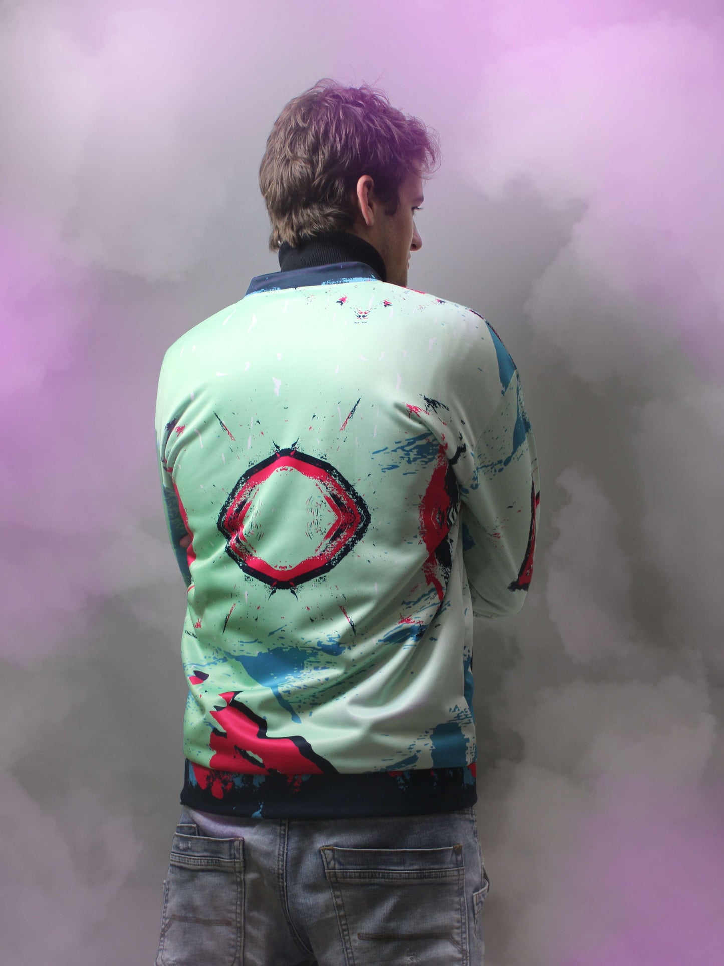 the backside of the light green retro jacket. the deep pink and purple contrasts very well with the lime green to create a very unique and colourful piece of outerwear