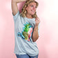a tropical t-shirt featuring a pineapple, a cocktail and sunglasses. The ultimate bright and colourful summertime t-shirt in light blue